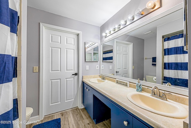 4236 Pondapple Dr, Titusville, FL 32796 - full bathroom with toilet, wood finished floors, and double vanity