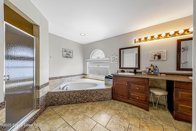 4236 Pondapple Dr, Titusville, FL 32796 - bathroom with vanity, a garden tub, a shower stall, and tile patterned flooring