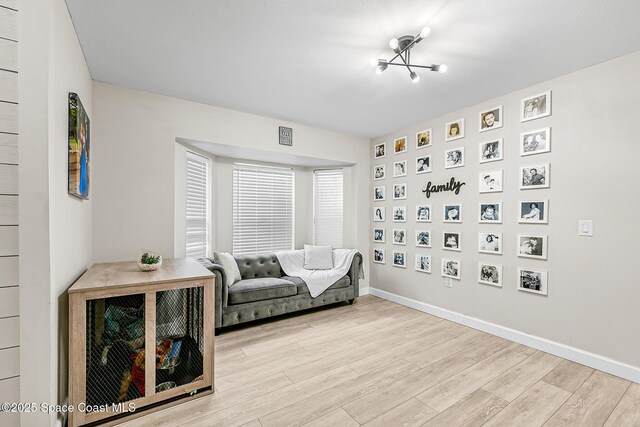 4236 Pondapple Dr, Titusville, FL 32796 - sitting room with wood finished floors and baseboards
