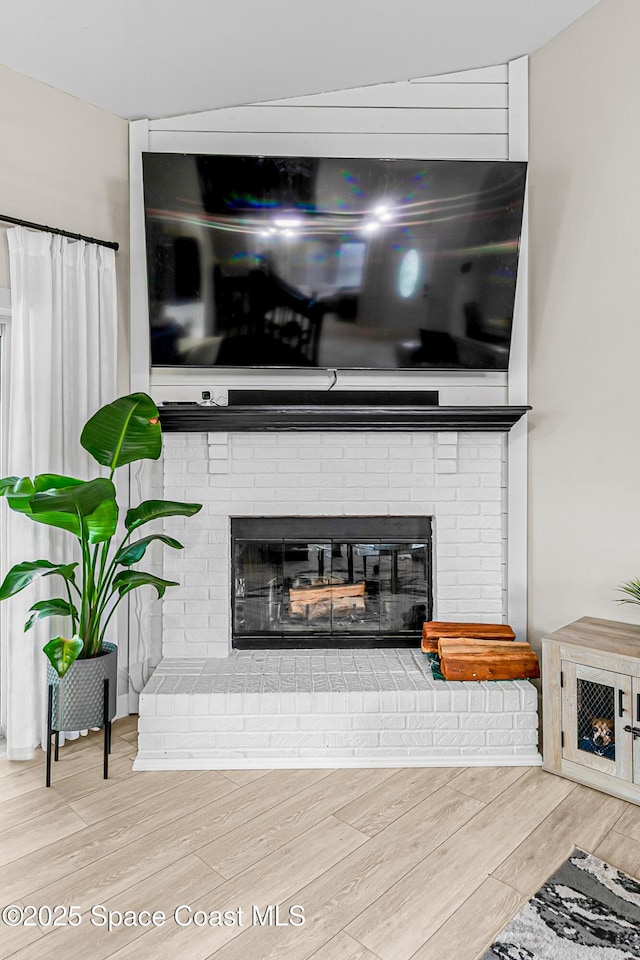 4236 Pondapple Dr, Titusville, FL 32796 - detailed view of a brick fireplace and wood finished floors