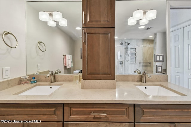 3221 S Atlantic Ave Unit 703, Cocoa Beach, FL 32931 - full bath with double vanity and an enclosed shower