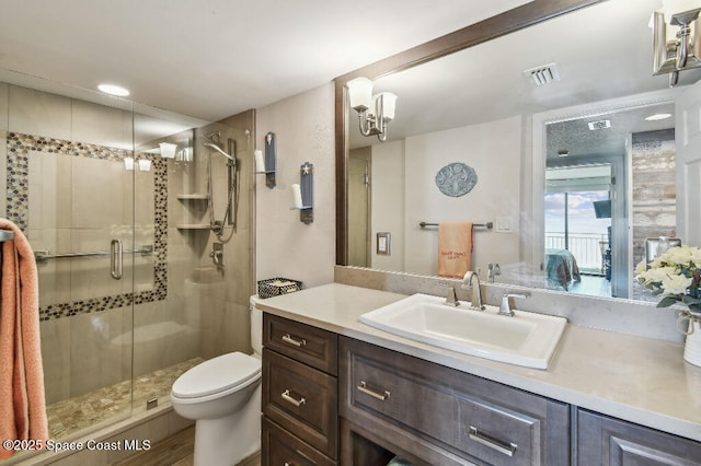 3221 S Atlantic Ave Unit 703, Cocoa Beach, FL 32931 - full bathroom featuring vanity, a stall shower, and toilet
