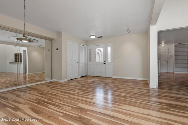105 Osprey Ct, Melbourne, FL 32940 - foyer entrance featuring light wood-style floors and baseboards