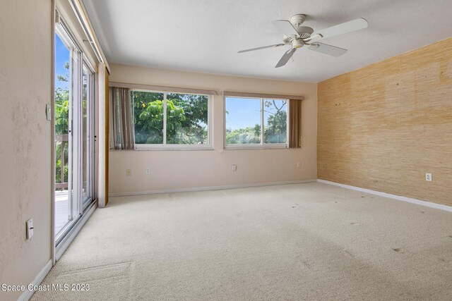 105 Osprey Ct, Melbourne, FL 32940 - empty room featuring carpet floors, plenty of natural light, and baseboards
