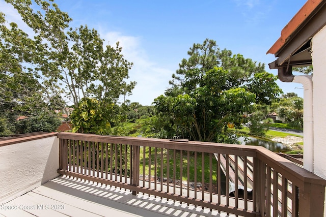 105 Osprey Ct, Melbourne, FL 32940 - wooden terrace with a water view