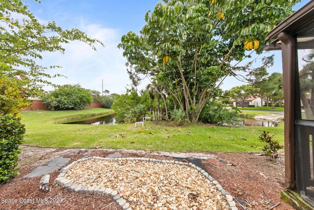 105 Osprey Ct, Melbourne, FL 32940 - view of grassy yard with a water view