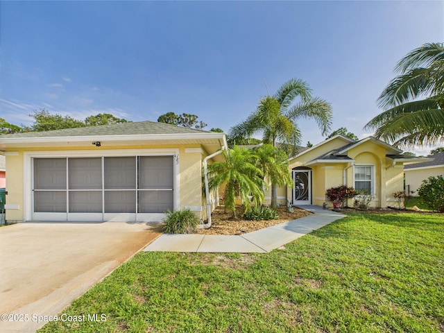 187 S Wimbrow Dr, Sebastian, FL 32958 - single story home with driveway, a garage, stucco siding, and a front lawn