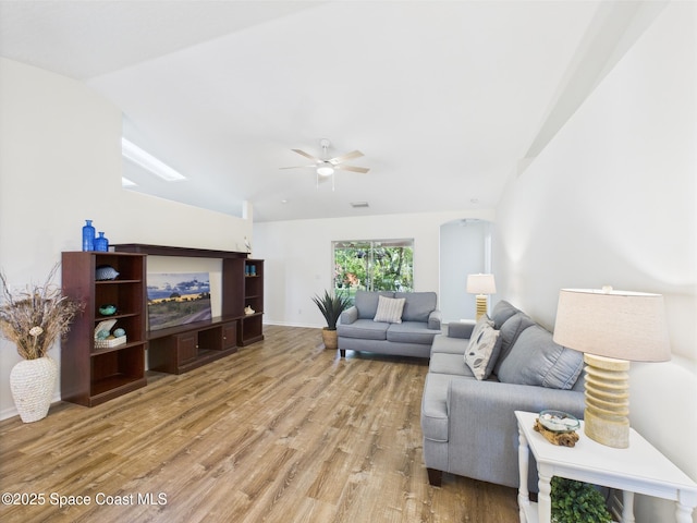 187 S Wimbrow Dr, Sebastian, FL 32958 - living room with light wood-type flooring, ceiling fan, lofted ceiling, and a skylight