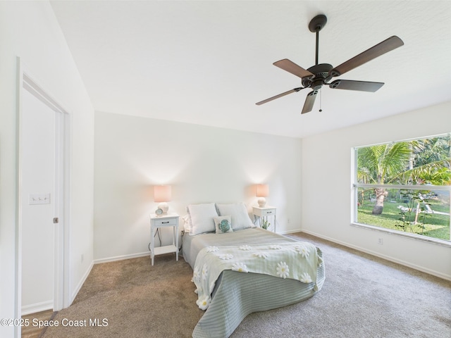 187 S Wimbrow Dr, Sebastian, FL 32958 - bedroom featuring carpet, baseboards, and ceiling fan