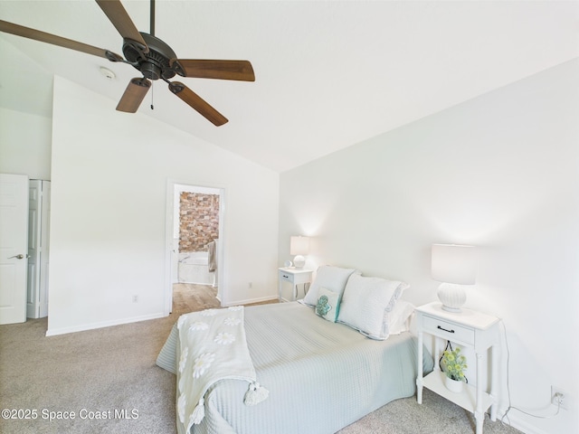 187 S Wimbrow Dr, Sebastian, FL 32958 - bedroom with vaulted ceiling, carpet floors, baseboards, a ceiling fan, and ensuite bath