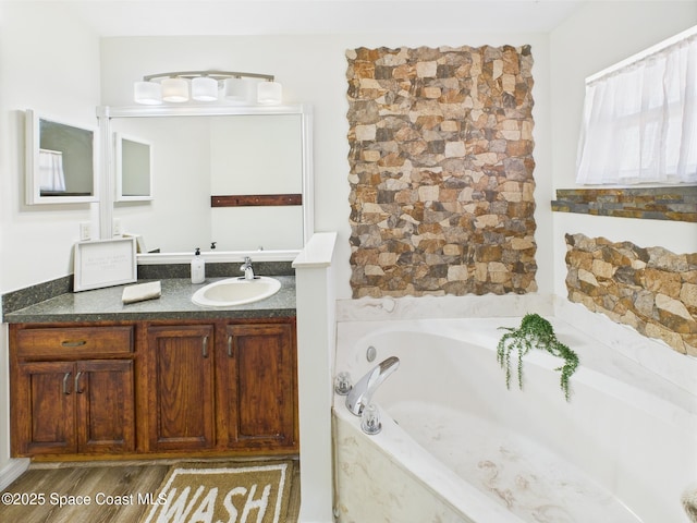 187 S Wimbrow Dr, Sebastian, FL 32958 - bathroom with a bath, vanity, and wood finished floors
