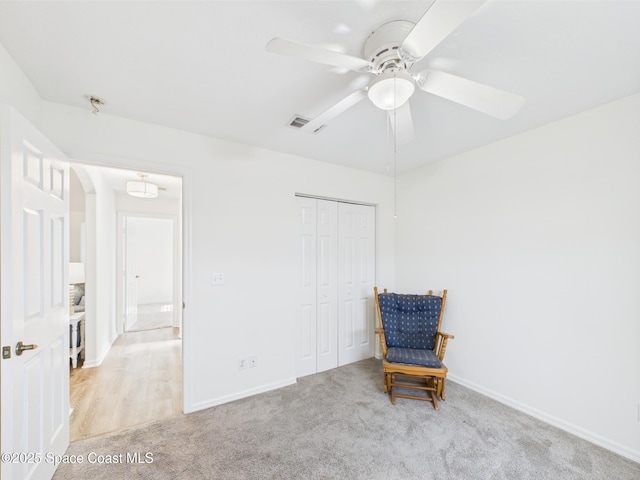 187 S Wimbrow Dr, Sebastian, FL 32958 - living area featuring light colored carpet, ceiling fan, and baseboards