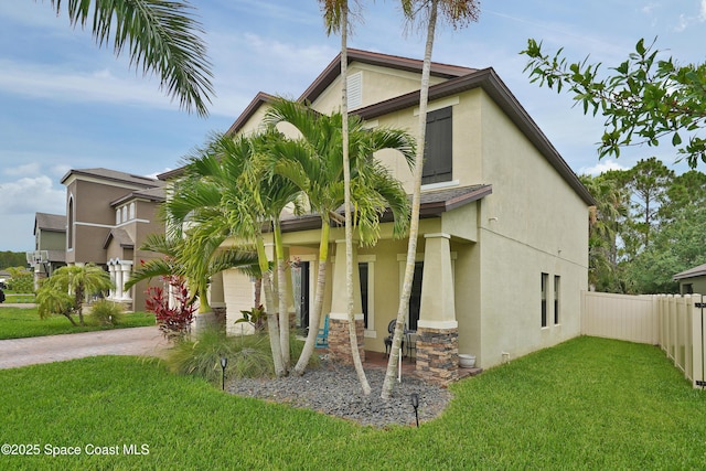 1403 Musgrass Cir, West Melbourne, FL 32904 - view of front of property with stucco siding and driveway