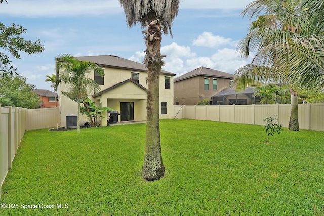 1403 Musgrass Cir, West Melbourne, FL 32904 - rear view of property with stucco siding and central air condition unit