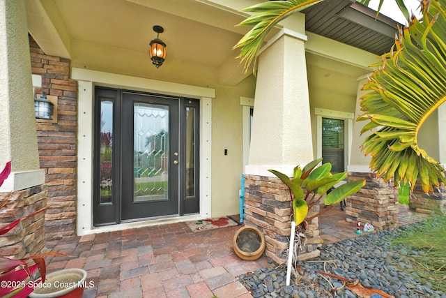 1403 Musgrass Cir, West Melbourne, FL 32904 - entrance to property featuring stucco siding and stone siding
