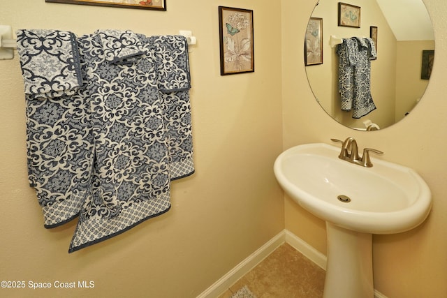 1403 Musgrass Cir, West Melbourne, FL 32904 - bathroom with baseboards and tile patterned flooring