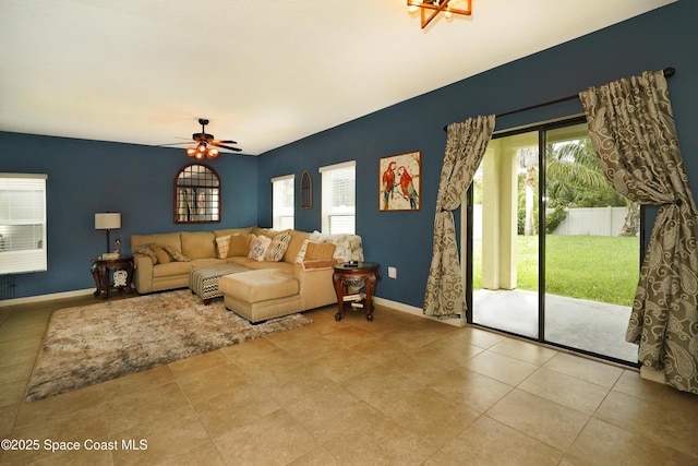 1403 Musgrass Cir, West Melbourne, FL 32904 - tiled living room featuring baseboards and ceiling fan