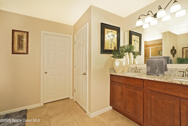1403 Musgrass Cir, West Melbourne, FL 32904 - full bathroom with double vanity, a shower stall, baseboards, and tile patterned flooring