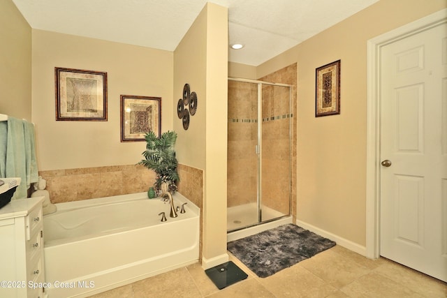 1403 Musgrass Cir, West Melbourne, FL 32904 - bathroom featuring a bath, a stall shower, vanity, tile patterned flooring, and baseboards