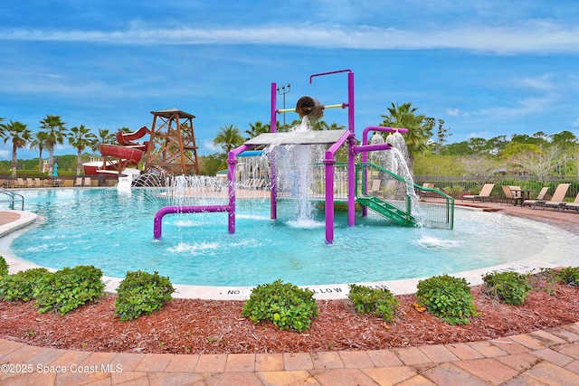 1403 Musgrass Cir, West Melbourne, FL 32904 - community pool with a water play area and a water slide