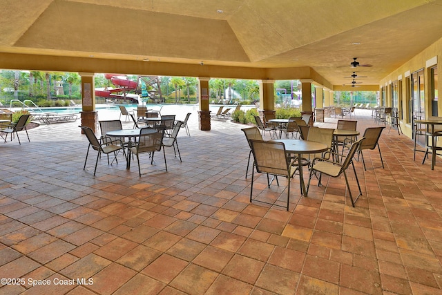 1403 Musgrass Cir, West Melbourne, FL 32904 - view of patio / terrace featuring a community pool and outdoor dining area