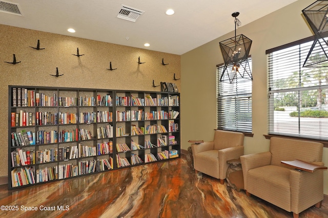 1403 Musgrass Cir, West Melbourne, FL 32904 - sitting room with recessed lighting and wood finished floors