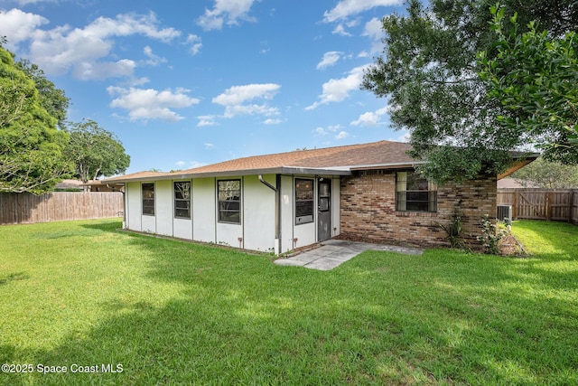 3137 Village Park Dr, Melbourne, FL 32934 - back of property with brick siding and central AC