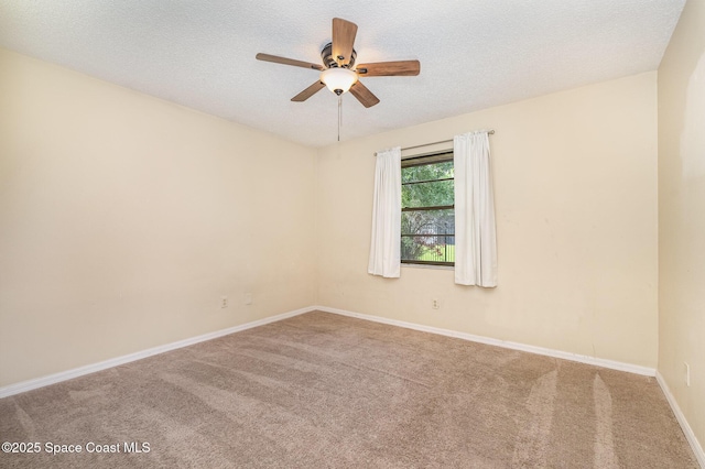 3137 Village Park Dr, Melbourne, FL 32934 - spare room featuring carpet, ceiling fan, a textured ceiling, and baseboards