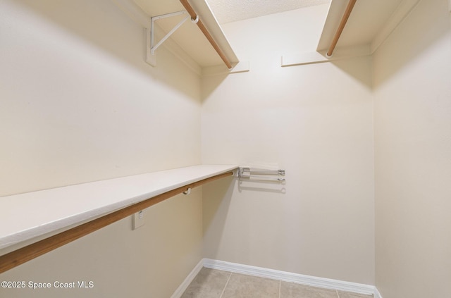 3137 Village Park Dr, Melbourne, FL 32934 - spacious closet with light tile patterned floors