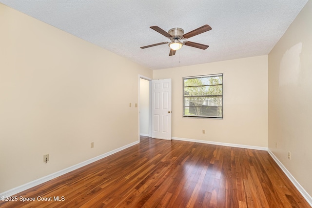 3137 Village Park Dr, Melbourne, FL 32934 - spare room featuring wood-type flooring, ceiling fan, baseboards, and a textured ceiling