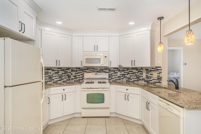3137 Village Park Dr, Melbourne, FL 32934 - kitchen with white appliances, a sink, a peninsula, light tile patterned flooring, and tasteful backsplash