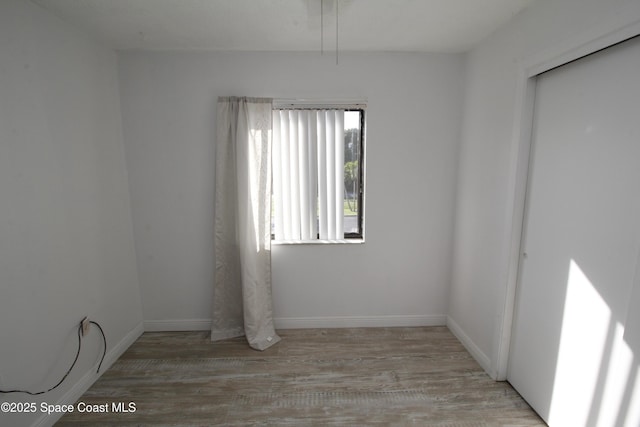 217 San Juan Cir, Melbourne, FL 32935 - empty room with wood finished floors and baseboards