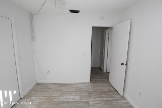 217 San Juan Cir, Melbourne, FL 32935 - unfurnished room with light wood-style floors and baseboards