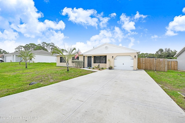 946 Stage St SE, Palm Bay, FL 32909 - single story home featuring a garage, driveway, and stucco siding