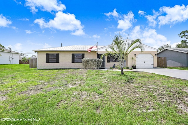 946 Stage St SE, Palm Bay, FL 32909 - ranch-style house with stucco siding, driveway, and an attached garage
