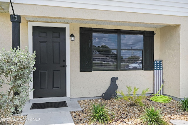 946 Stage St SE, Palm Bay, FL 32909 - view of exterior entry with stucco siding