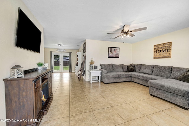 946 Stage St SE, Palm Bay, FL 32909 - living room featuring ceiling fan, french doors, and light tile patterned floors