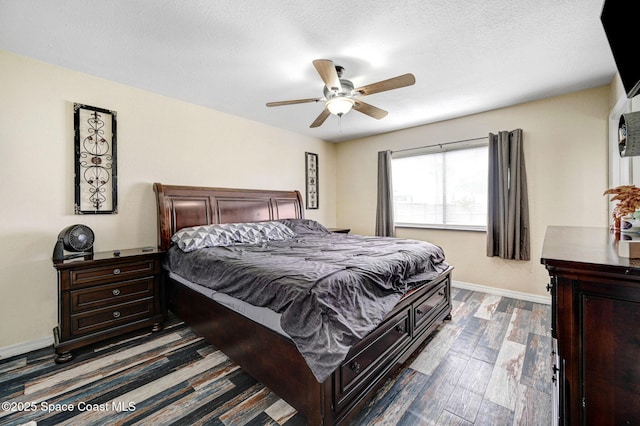 946 Stage St SE, Palm Bay, FL 32909 - bedroom with baseboards, dark wood-style floors, and ceiling fan