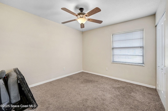 946 Stage St SE, Palm Bay, FL 32909 - carpeted spare room with a ceiling fan and baseboards