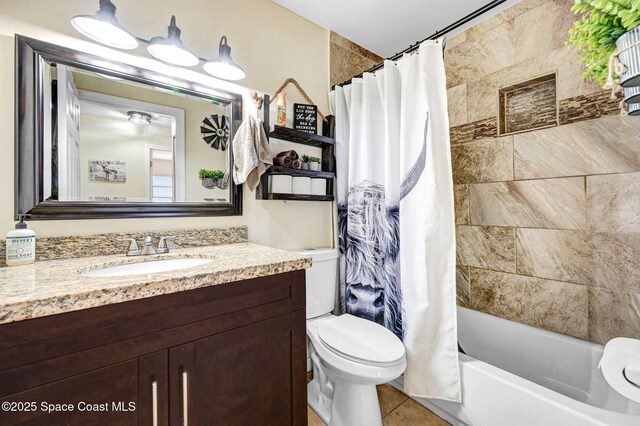 946 Stage St SE, Palm Bay, FL 32909 - full bath featuring vanity, toilet, shower / tub combo, and tile patterned flooring