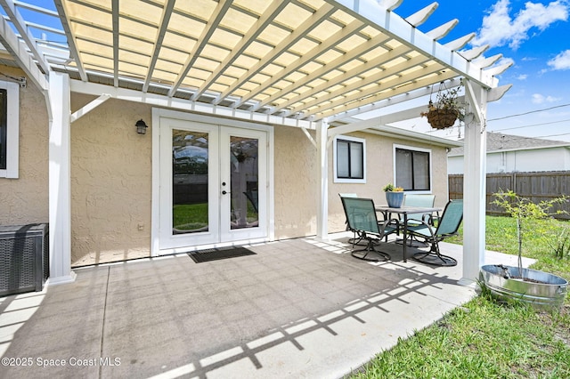 946 Stage St SE, Palm Bay, FL 32909 - view of patio / terrace featuring french doors, a pergola, and outdoor dining area
