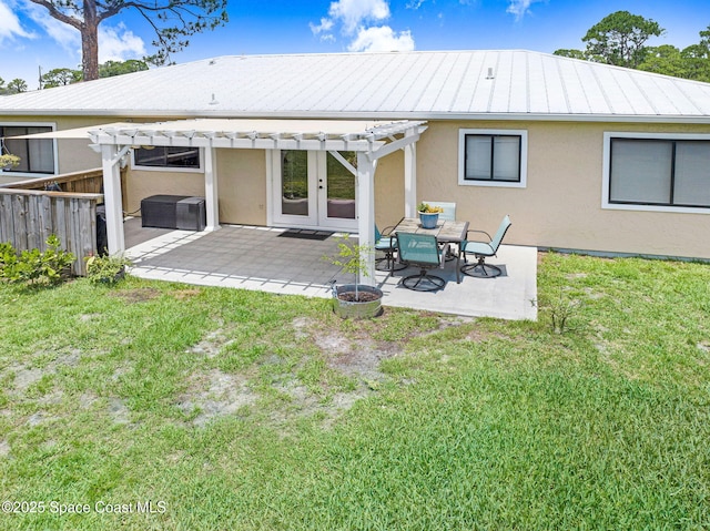 946 Stage St SE, Palm Bay, FL 32909 - rear view of property featuring stucco siding, a pergola, a patio, french doors, and metal roof