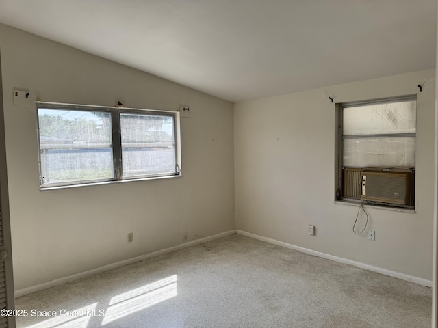 2262 Port Malabar Blvd NE, Palm Bay, FL 32905 - unfurnished room with cooling unit, vaulted ceiling, carpet, and baseboards