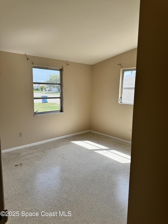 2262 Port Malabar Blvd NE, Palm Bay, FL 32905 - empty room with plenty of natural light and baseboards