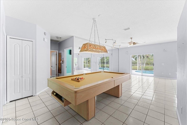 990 Harbor Pines Dr, Merritt Island, FL 32952 - recreation room with light tile patterned flooring, a textured ceiling, billiards table, a ceiling fan, and baseboards