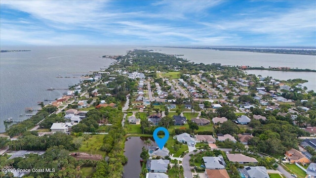 990 Harbor Pines Dr, Merritt Island, FL 32952 - aerial overview of property's location with a large body of water and nearby suburban area