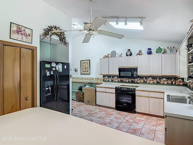 750 SW 91st Pl, Ocala, FL 34476 - kitchen featuring black appliances, lofted ceiling, a sink, track lighting, and a ceiling fan