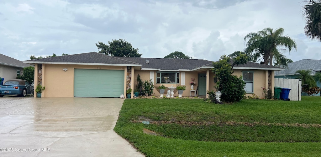 985 George St, Sebastian, FL 32958 - ranch-style house with concrete driveway, a garage, stucco siding, and a front yard
