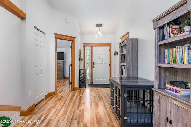 4027 Secretariat Ln, Malabar, FL 32950 - foyer featuring light wood-type flooring and baseboards