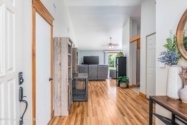 4027 Secretariat Ln, Malabar, FL 32950 - foyer with light wood-type flooring, ceiling fan, vaulted ceiling, and baseboards